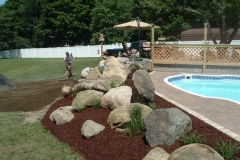 Finished: Pavers around pool / large stones